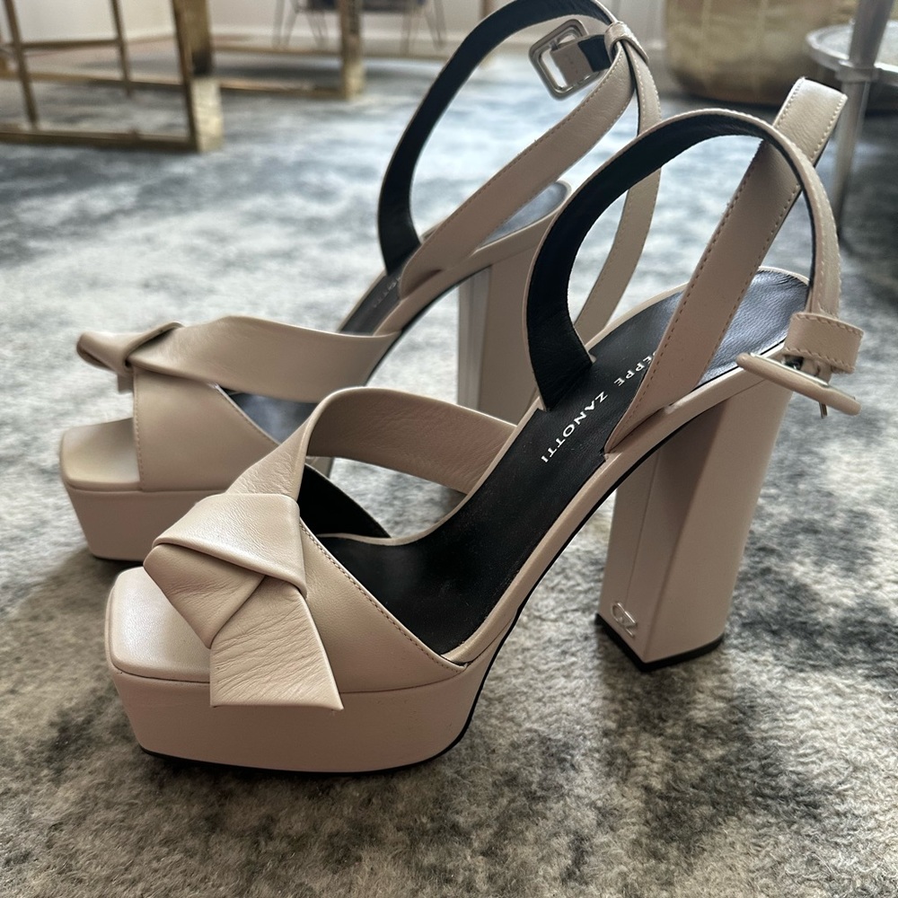 Like new worn 1-2x Guiseppe Zanotti platform block heels. Cream color.